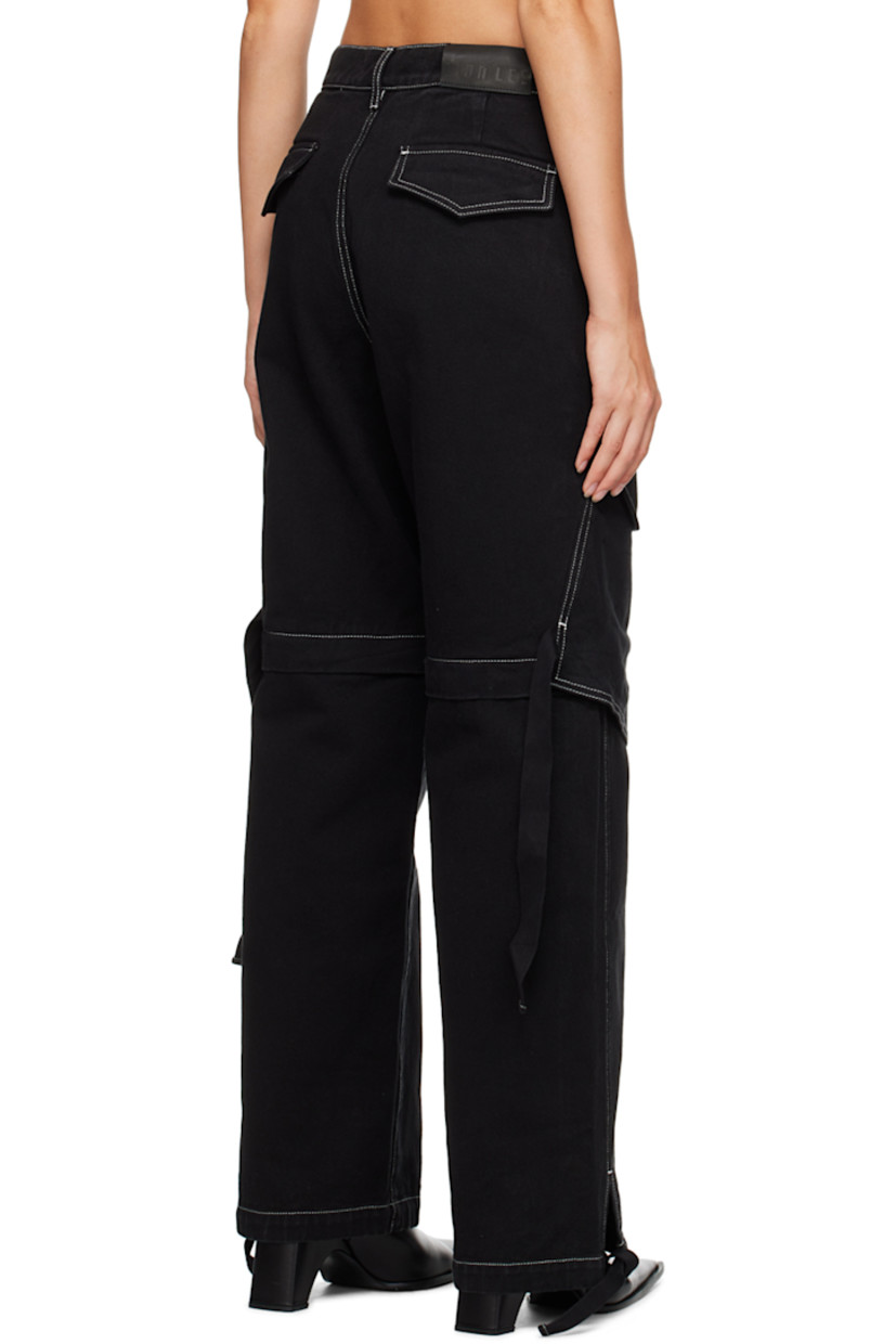 Relaxed-fit straight-leg garment-dyed non-stretch denim jeans. 

· Belt loops 
· Four-pocket styling 
· Zip-fly 
· Flap pockets at leg 
· Detachable zip panel at legs for alternate styling 
· Drawstring at cuffs 
· Leather logo patch at back waistband 
· Strap detailing at back 
· Contrast stitching in white 

Supplier color: Black