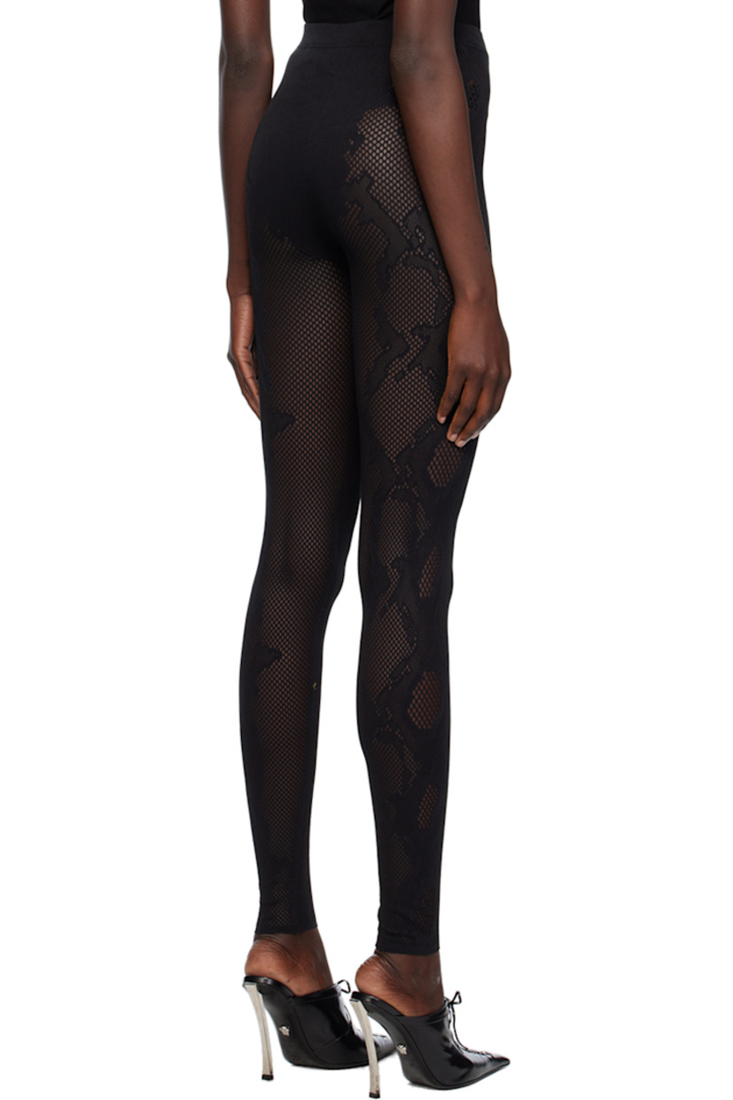 Stretch recycled nylon-blend mesh leggings. Jacquard snakeskin pattern throughout.

· Seamless construction
· High-rise
· Elasticized waistband
· Raw edge at hem
· Unlined

Supplier color: Black