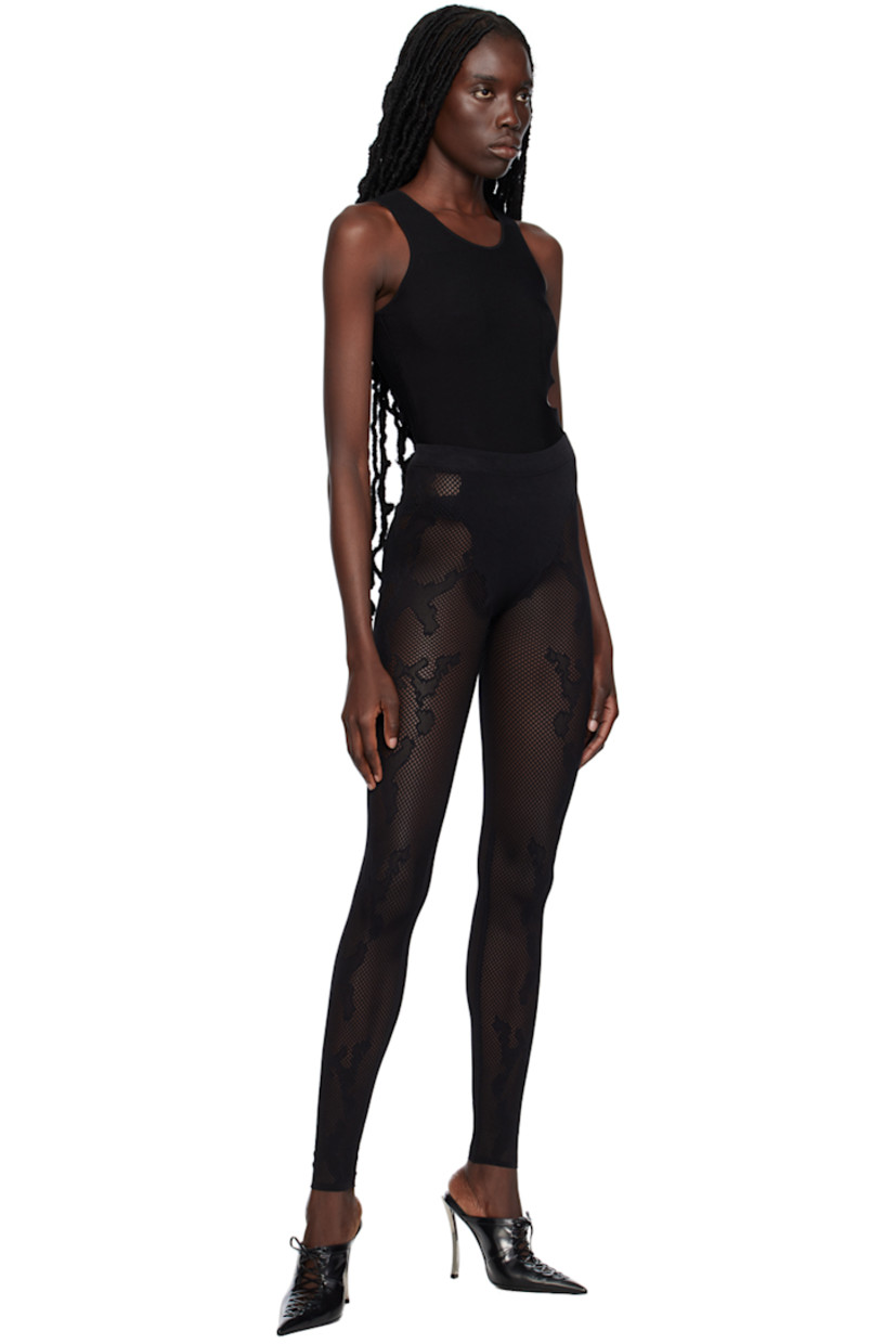 Stretch recycled nylon-blend mesh leggings. Jacquard snakeskin pattern throughout.

· Seamless construction
· High-rise
· Elasticized waistband
· Raw edge at hem
· Unlined

Supplier color: Black