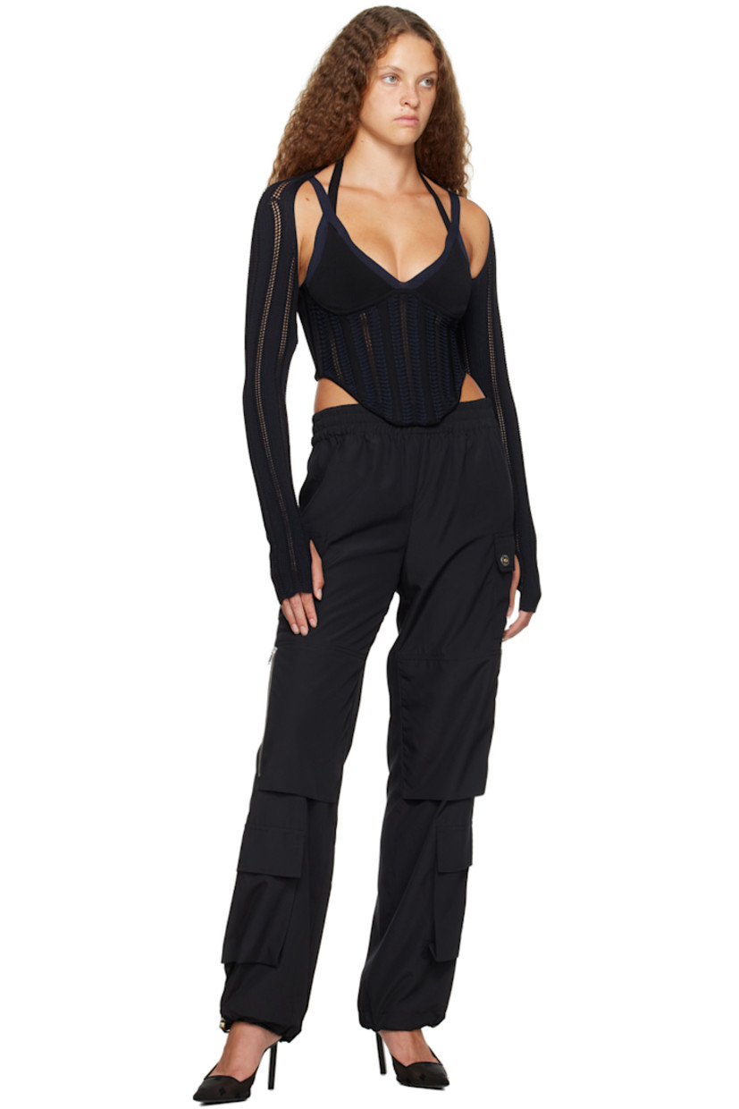 Plain-woven recycled polyester trousers.

· Paneled construction
· Elasticized waistband
· Four-pocket styling
· Patch and zip pockets at front
· Bungee-style drawstring at elasticized cuffs
· Logo-engraved silver-tone hardware

Supplier color: Black