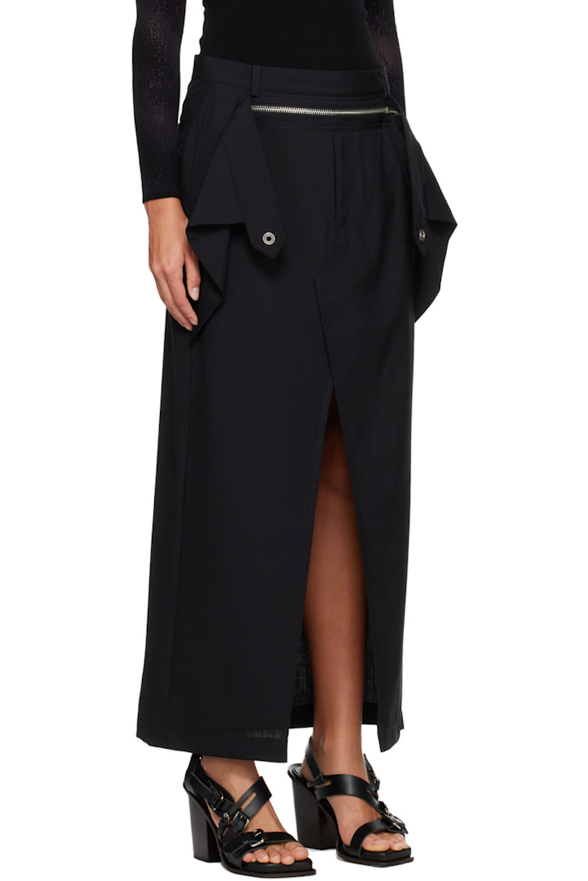 Wool graine de poudre skirt. 

· Belt loops 
· Zip detailing at waist 
· Four-pocket styling 
· Zip-fly 
· Slit at hem 
· Concealed zip closure at back 

Supplier color: Black