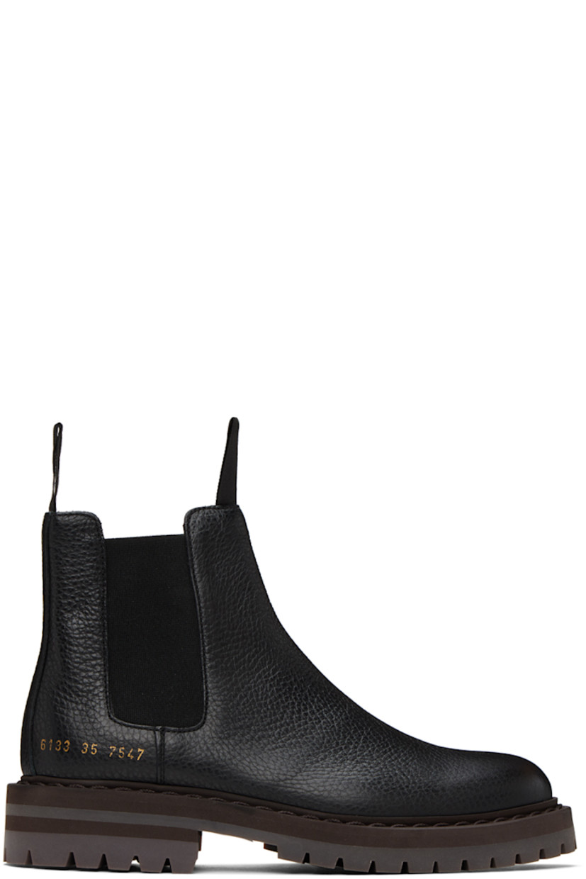 Ankle-high grained leather Chelsea boots in black. Signature series stamp in gold-tone at outer side.

· Grosgrain pull-loops at collar
· Elasticized gusset at sides
· Buffed leather lining in tan
· Stacked foam rubber midsole
· Treaded rubber sole
· Heel: H1.5 in

Supplier color: Black