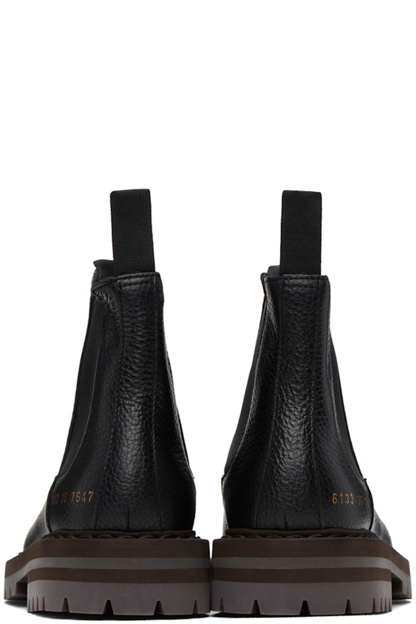 Ankle-high grained leather Chelsea boots in black. Signature series stamp in gold-tone at outer side.

· Grosgrain pull-loops at collar
· Elasticized gusset at sides
· Buffed leather lining in tan
· Stacked foam rubber midsole
· Treaded rubber sole
· Heel: H1.5 in

Supplier color: Black