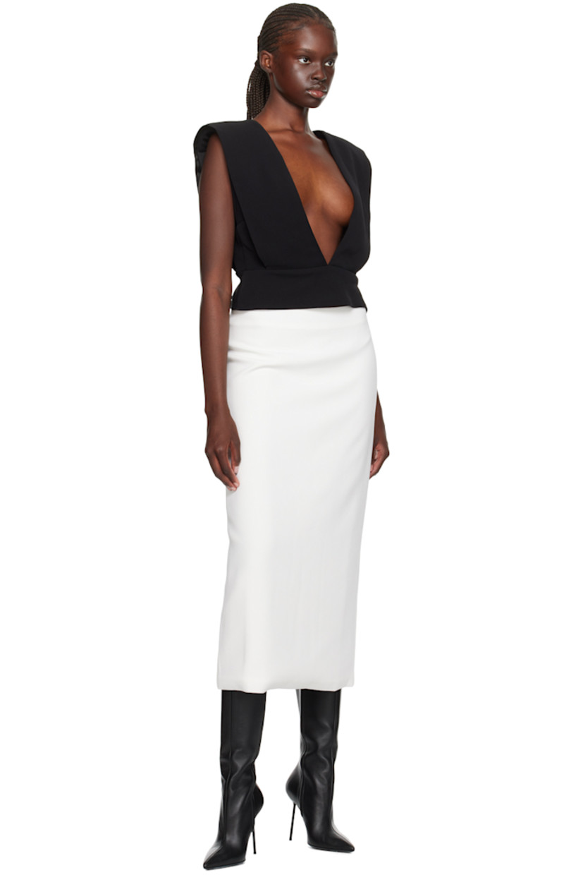 Polyester crepe tank top. 

· Layered construction
· Plunging V-neck
· Padded shoulders
· Low back
· Partial satin lining

Supplier color: Black