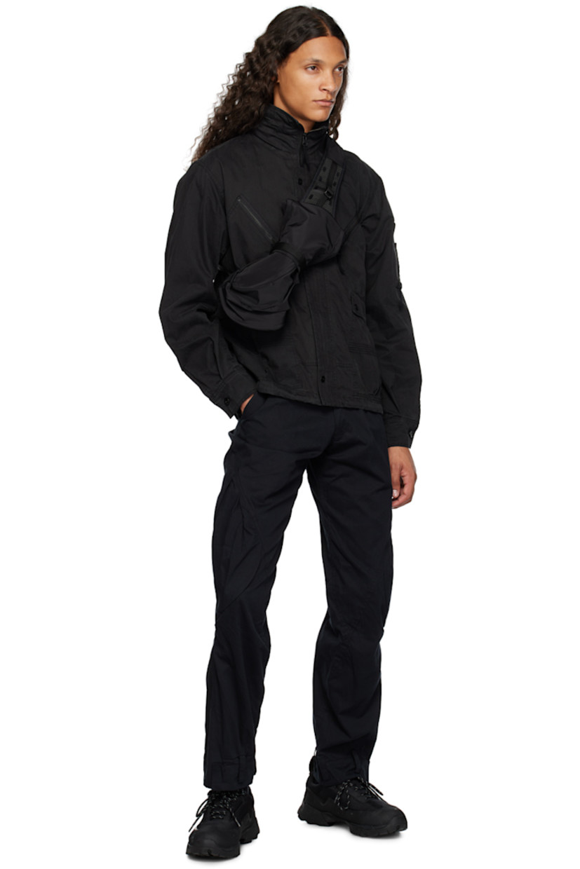 Cotton- and nylon-blend twill cargo pants.

· Paneled construction
· Belt loops at waistband and cuffs
· Four pocket styling
· Zip-fly
· Twin pleats at front
· Pleated patch pocket at knees
· Adjustable velcro tab at cuffs

Supplier color: Black