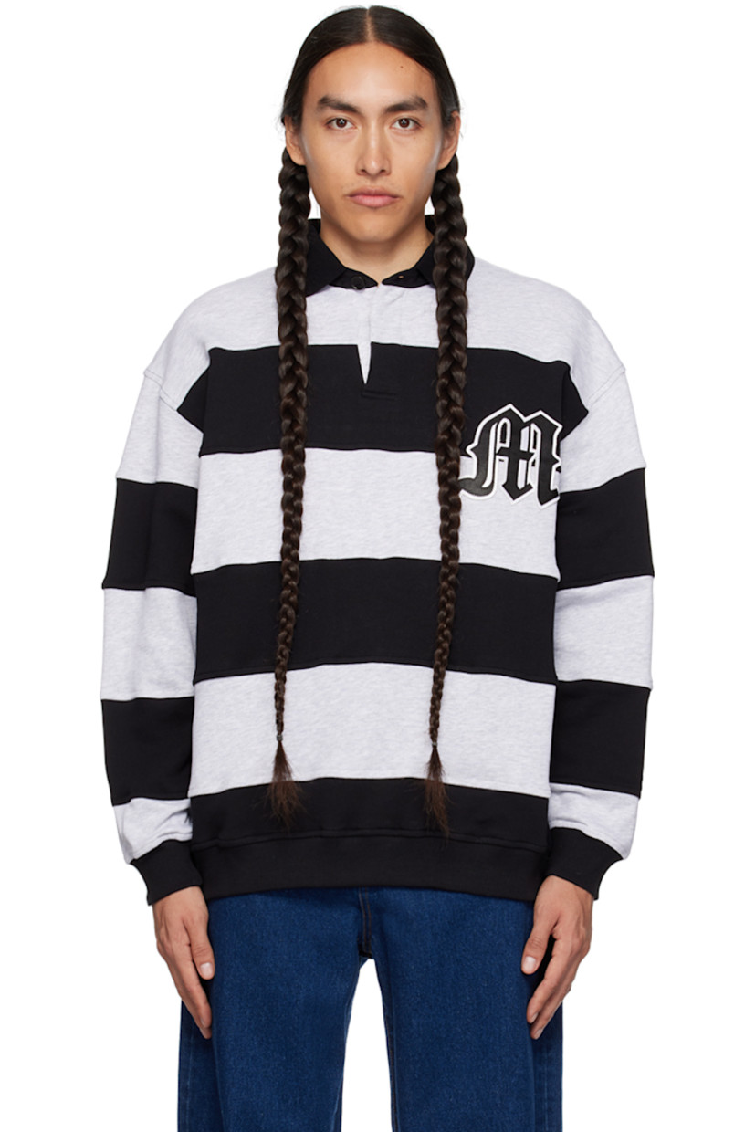 French terry polo. Stripes throughout. 

· Rib knit spread collar, hem, and cuffs
· Two-button placket
· Logo patch at chest
· Logo embroidered at back collar

Supplier color: Light gray