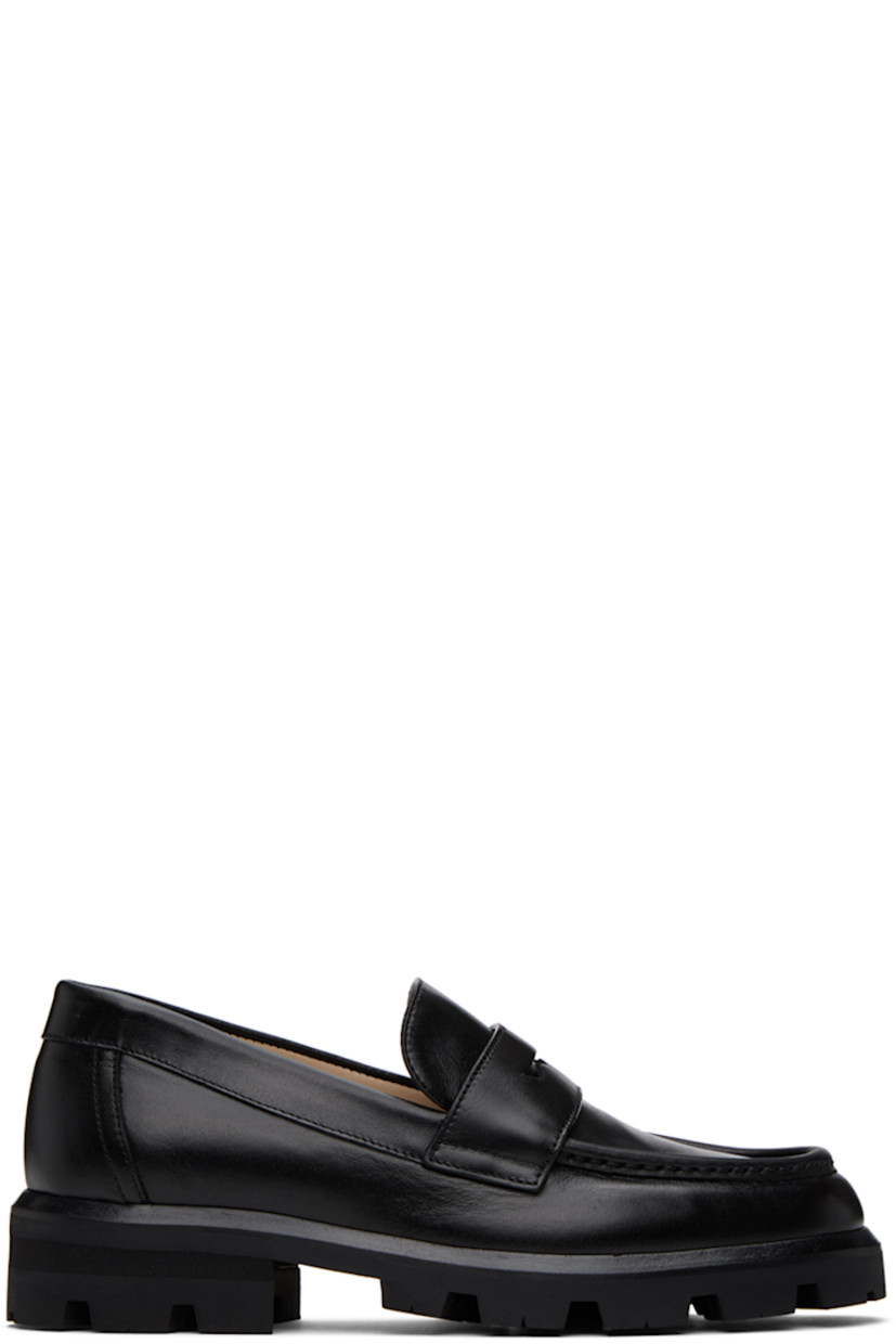 Buffed nappa leather loafers in black.

· Moc toe
· Strap with cutout at vamp
· Buffed leather and suede lining
· Treaded rubber sole

Supplier color: Black