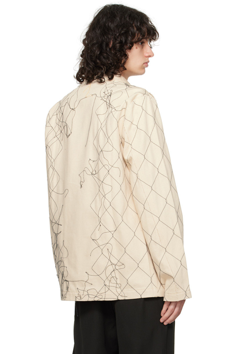 Handcrafted non-stretch organic cotton denim jacket. Embroidered graphic pattern, loose thread detailing, and raw edges throughout.

· Paneled construction
· Spread collar
· Concealed button closure
· Seam pockets
· Hand-stitched logo at back collar

Supplier color: Natural 2
