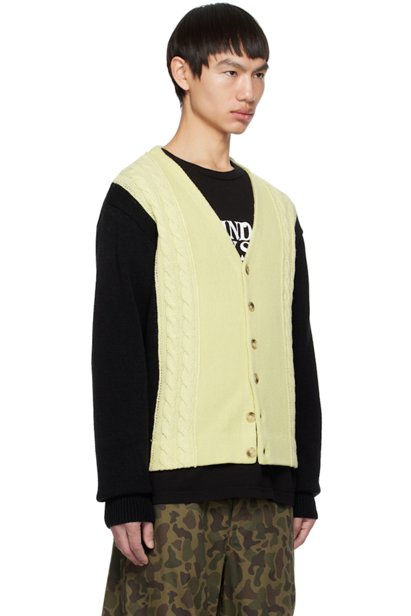 Cable knit wool- and acrylic-blend cardigan.

· Colorblocked consturction
· Rib knit Y-neck, hem, and cuffs
· Button closure
· Logo flag at side seam

Supplier color: Ivory/Black