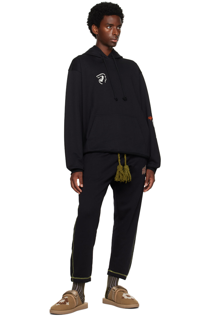 French terry hoodie. Hand-stitched tatreez embroidery and printed graphics throughout. 

· Drawstring at hood
· Kangaroo pocket
· Rib knit hem and cuffs

Supplier color: Black
