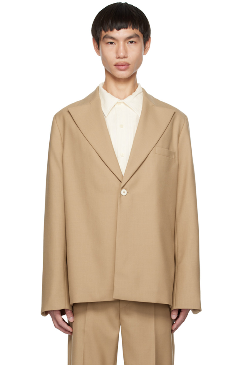 Polyester- and wool-blend twill blazer.

· Notched lapel
· Button closure
· Welt pocket 
· Padded shoulders
· Vented cuffs
· Welt pocket at interior
· Full satin lining

Supplier color: Beige breeze