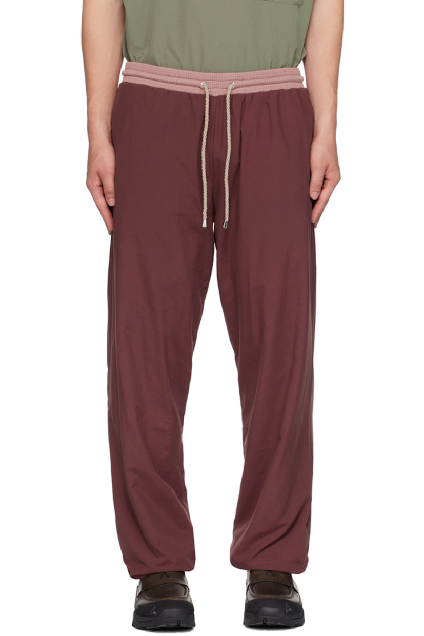 Cotton- and nylon-blend jersey track pants.

· Drawstring at elasticized waistband
· Two-pocket styling
· Elasticized cuffs
· Fully lined

Supplier color: Eggplant