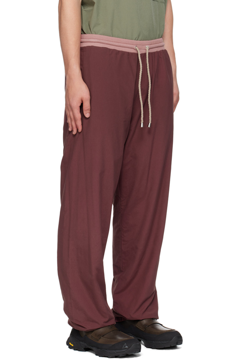 Cotton- and nylon-blend jersey track pants.

· Drawstring at elasticized waistband
· Two-pocket styling
· Elasticized cuffs
· Fully lined

Supplier color: Eggplant