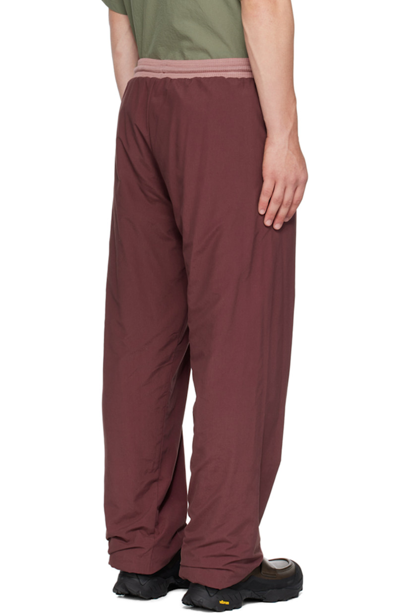 Cotton- and nylon-blend jersey track pants.

· Drawstring at elasticized waistband
· Two-pocket styling
· Elasticized cuffs
· Fully lined

Supplier color: Eggplant