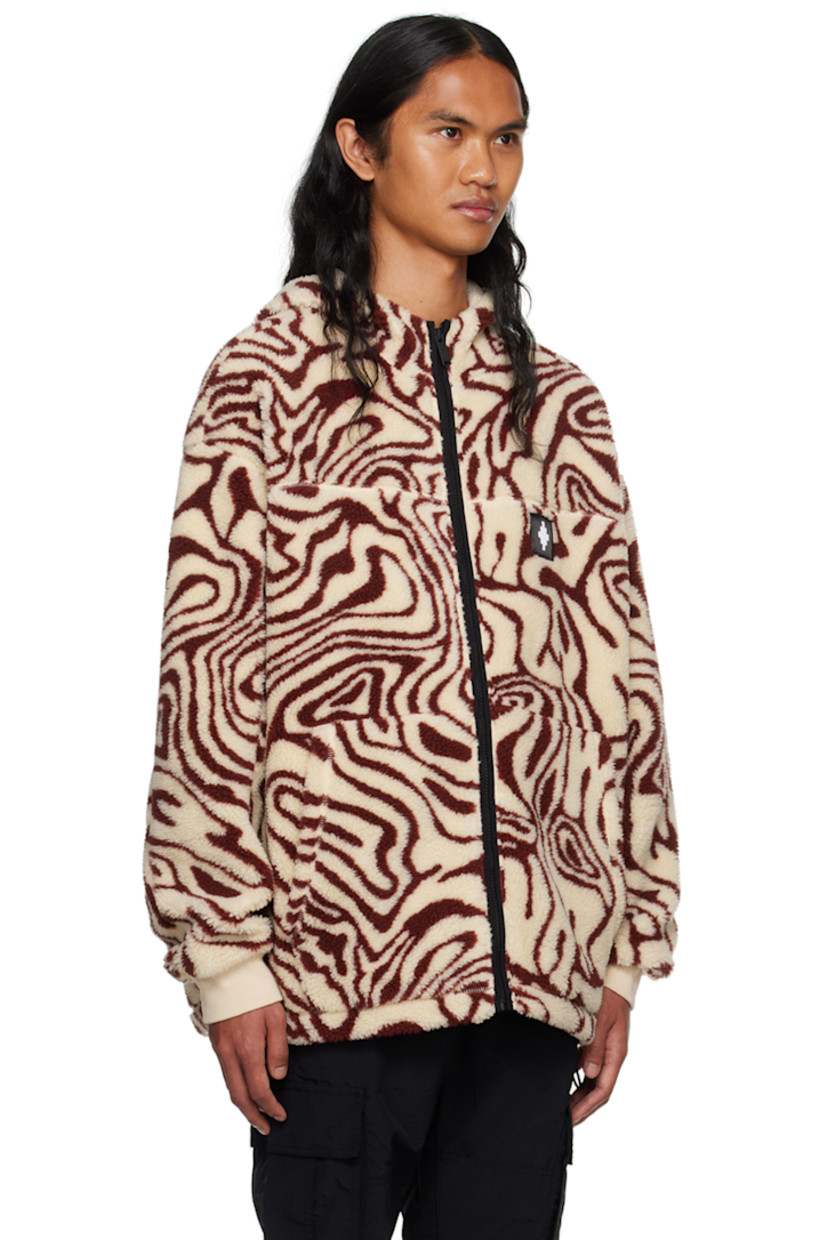 Sherpa fleece jacket. Graphic pattern printed throughout.

· Stand collar
· Zip closure
· Logo patch at chest
· Patch pockets
· Concealed bungee-style drawstring at hem
· Dropped shoulders
· Rib knit cuffs
· Full mesh lining
· Logo-engraved black hardware

Supplier color: Ecru/Burgundy