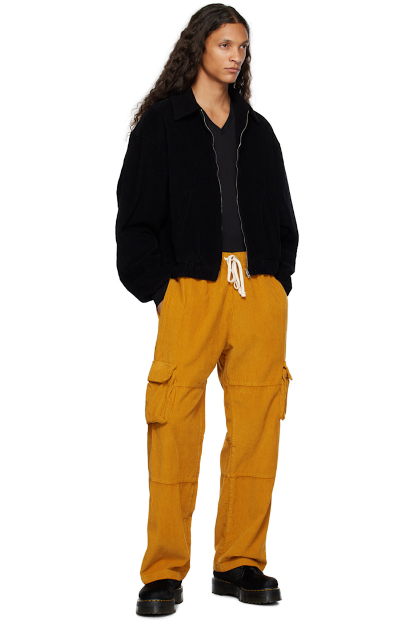 Wide-leg garment-dyed cotton corduroy cargo pants. 

· Pre-shrunk
· Drawstring at elasticized waistband
· Three-pocket styling
· Flap pocket at outseams 

Supplier color: Mustard