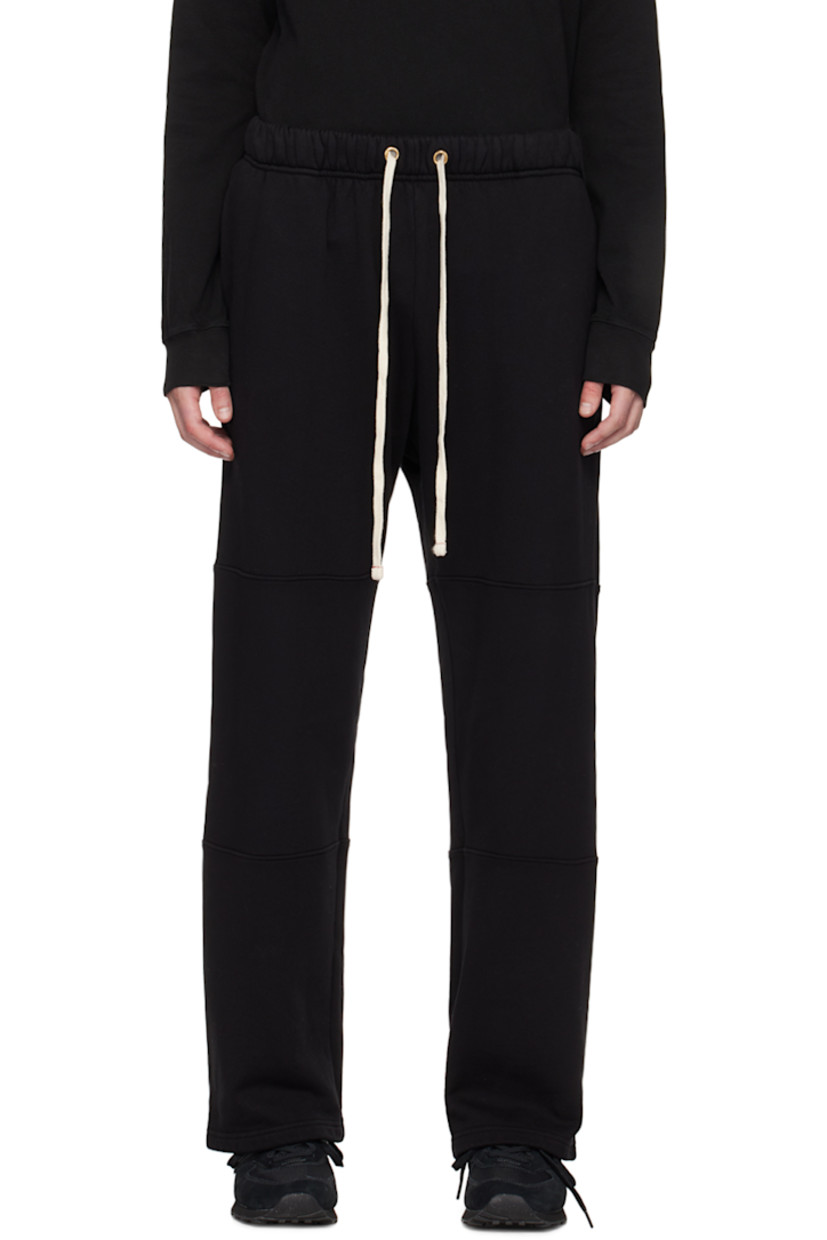 Garment-dyed cotton fleece sweatpants. 

· Pre-shrunk
· Drawstring at elasticized waistband
· Two-pocket styling

Supplier color: Jet black