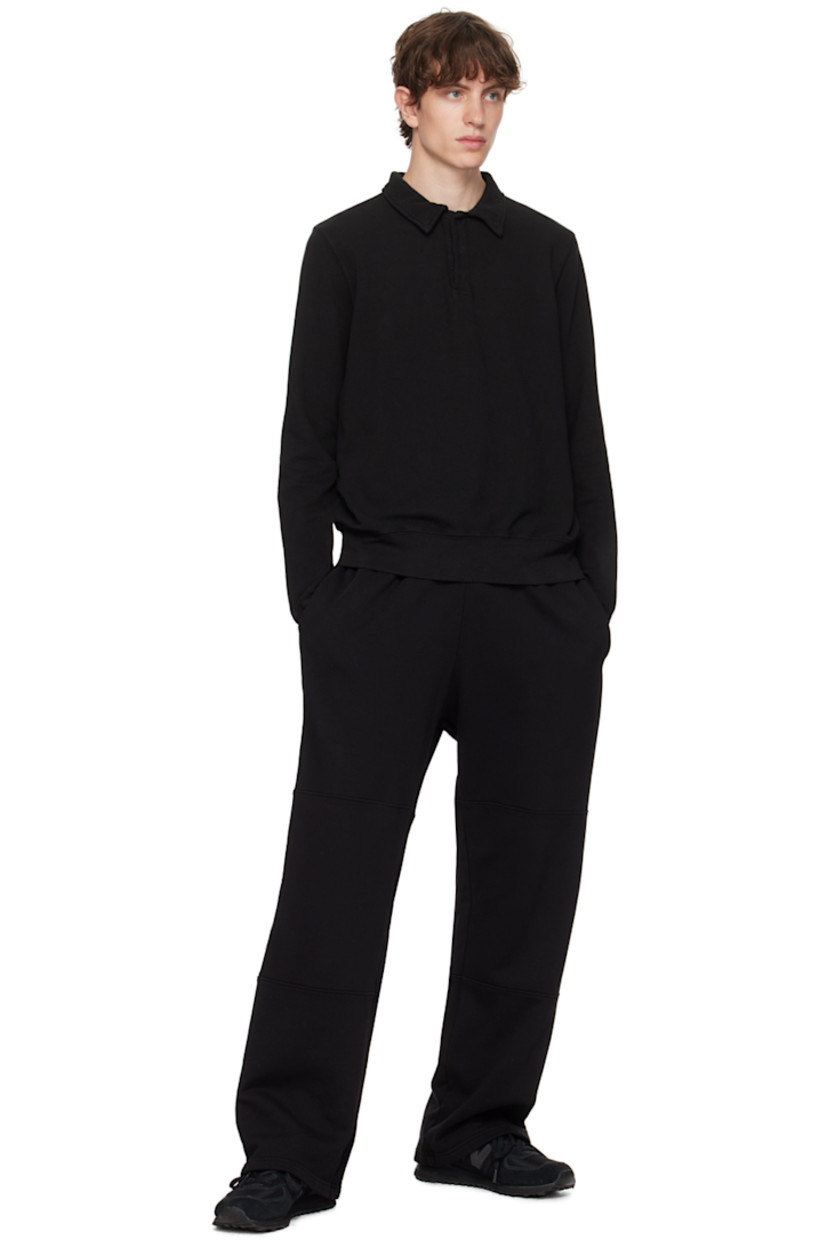 Garment-dyed cotton fleece sweatpants. 

· Pre-shrunk
· Drawstring at elasticized waistband
· Two-pocket styling

Supplier color: Jet black