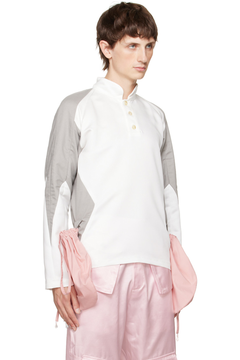Polyester twill and stretch cotton twill polo. Detachable drawstring pouches with crisscrossing straps. 

· Paneled construction
· Band collar
· Three-button placket
· Raglan sleeves

Available exclusively at SSENSE. 

Supplier color: Pink/Grey/White