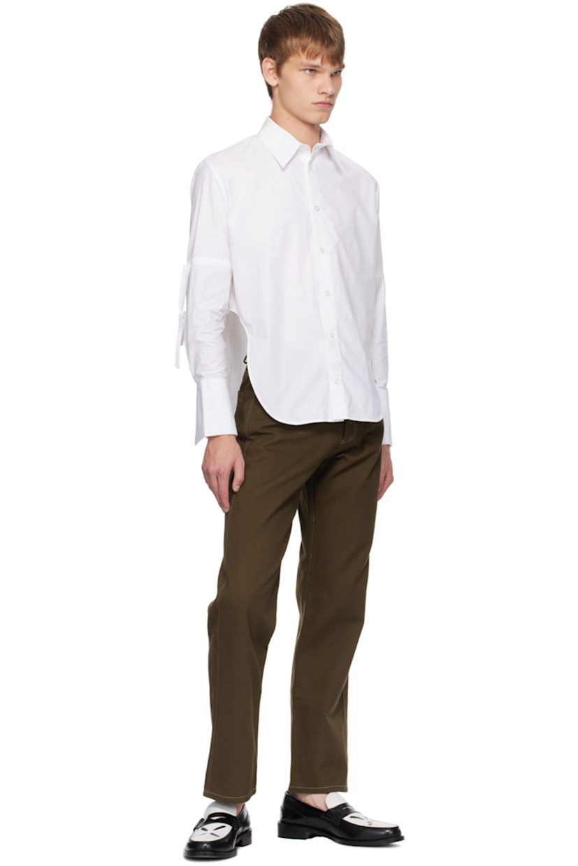 13.9 oz non-stretch denim jeans. 

· Belt loops
· Five-pocket styling
· Button-fly
· Contrast stitching in white

Supplier color: Brown