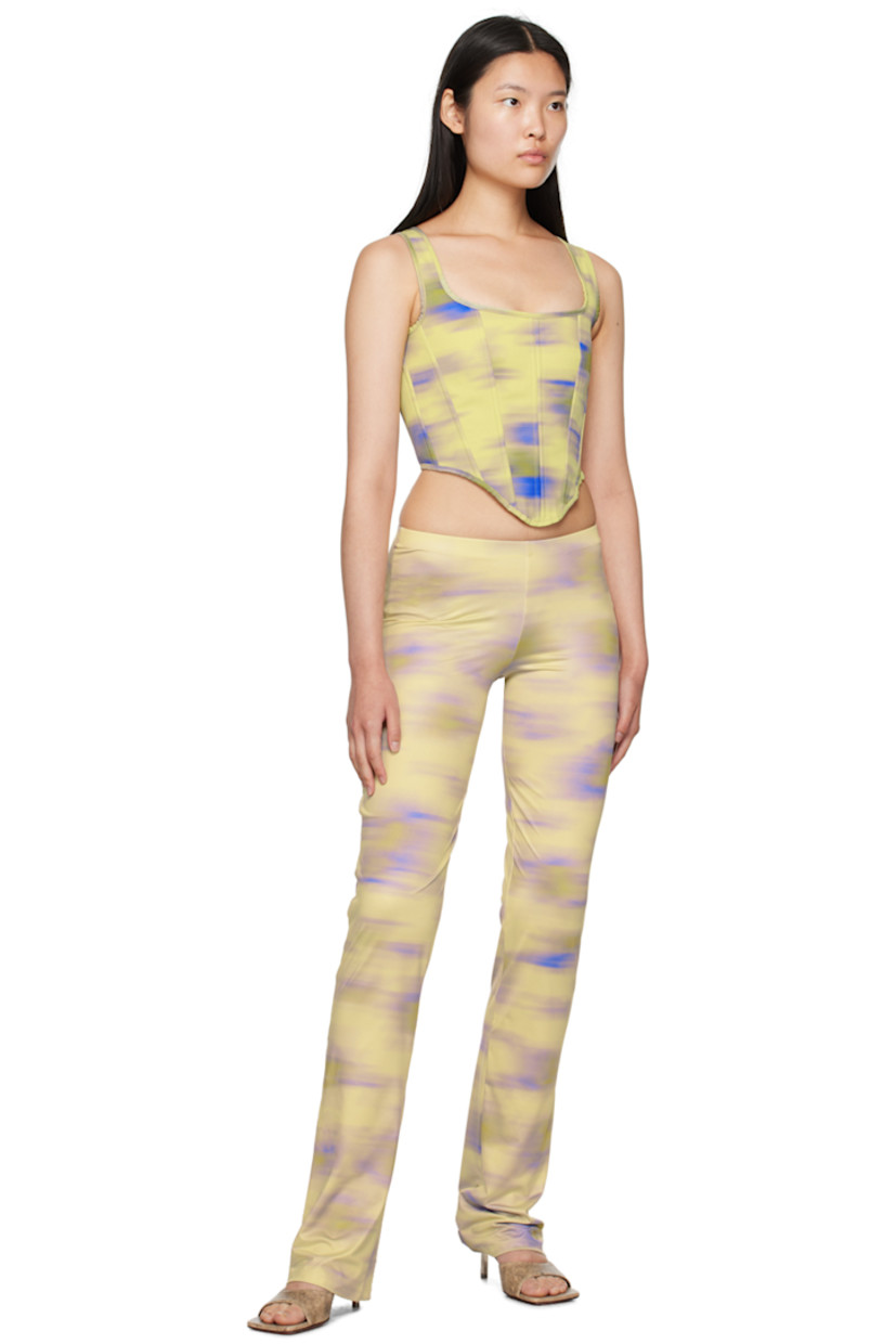 Handcrafted stretch polyester jersey trousers. Graphic pattern printed throughout.

· Elasticized waistband
· Unlined

Supplier color: Cayena