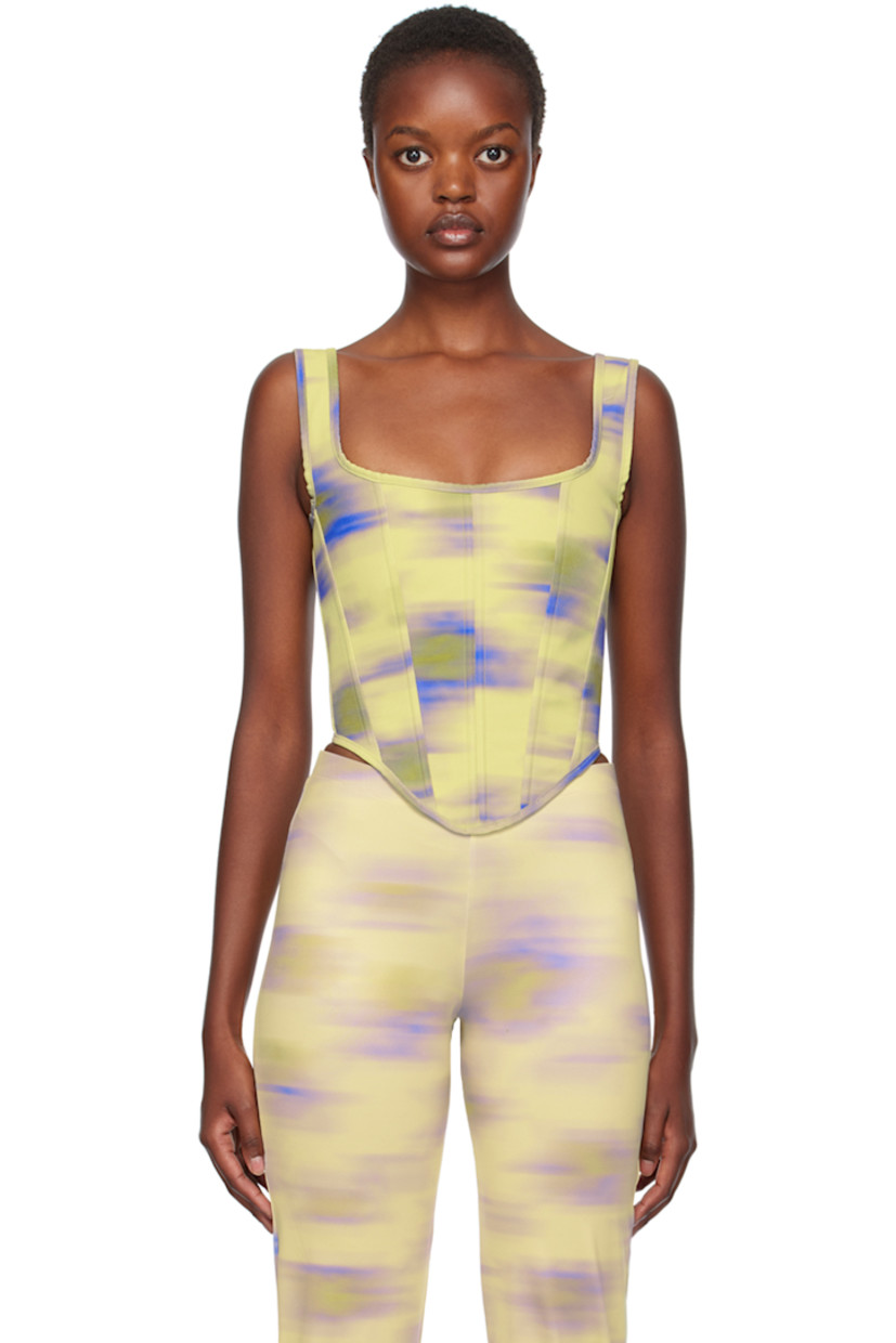 Handcrafted cotton drill corset. Boning and printed graphic pattern throughout.

· Square neck
· Curved hem
· Self-tie straps at back collar
· Lace-up closure at back
· Full cotton canvas lining

Supplier color: Cayena