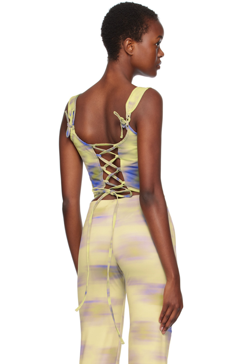 Handcrafted cotton drill corset. Boning and printed graphic pattern throughout.

· Square neck
· Curved hem
· Self-tie straps at back collar
· Lace-up closure at back
· Full cotton canvas lining

Supplier color: Cayena