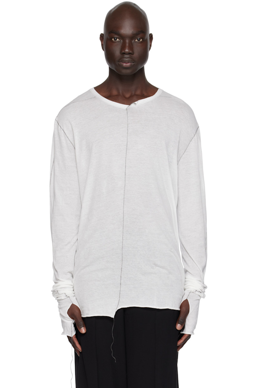 Handcrafted cotton jersey T-shirt. Loose thread detailing throughout.

· Asymmetric crewneck
· Rolled edge at hem and cuffs
· Thumbhole at cuffs
· Contrast stitching in black 

Supplier color: Ecru