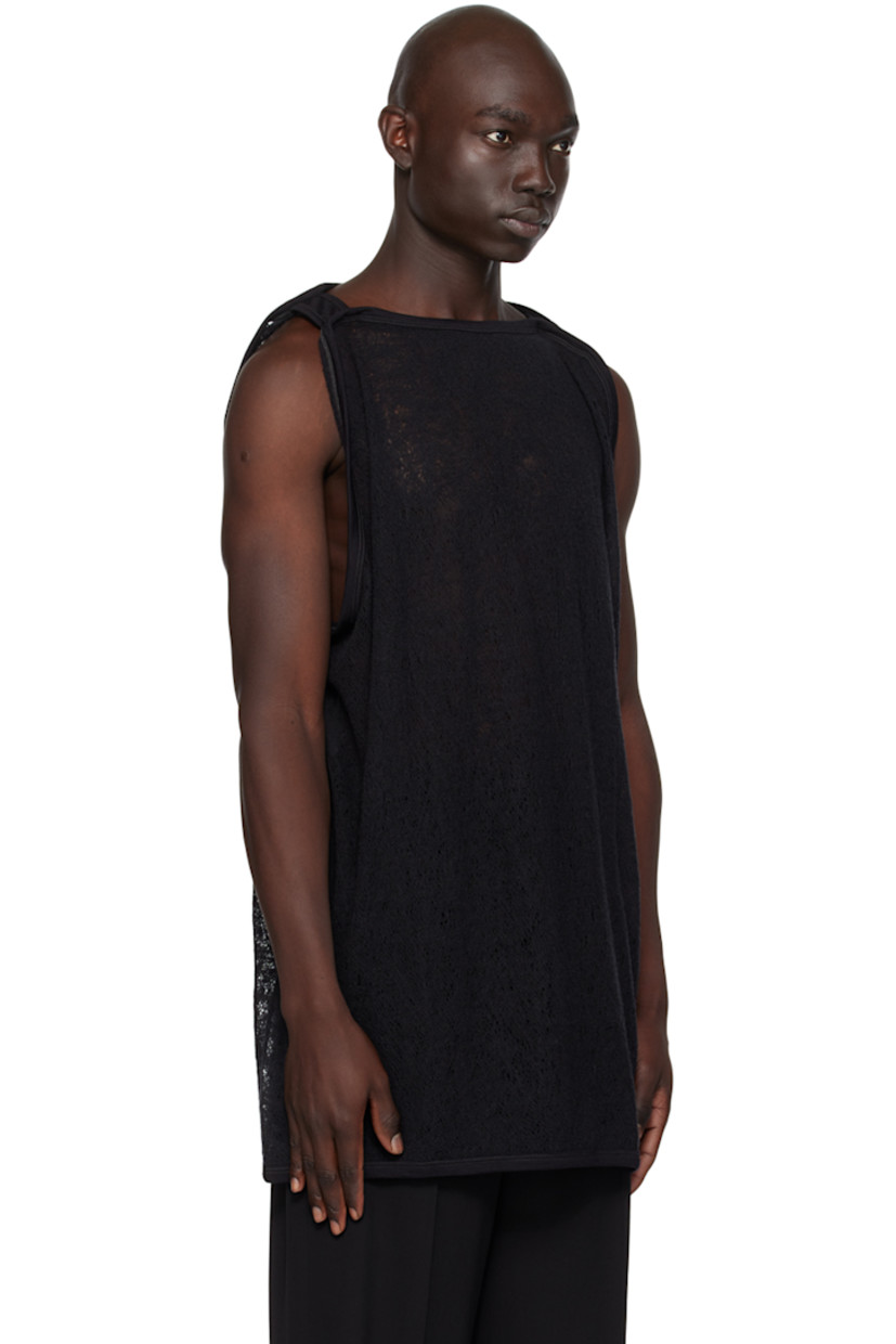 Handcrafted semi-sheer knit wool tank top. Rib knit boat neck, hem, and armscyes.

This item is part of a limited run of 15.

Supplier color: Black