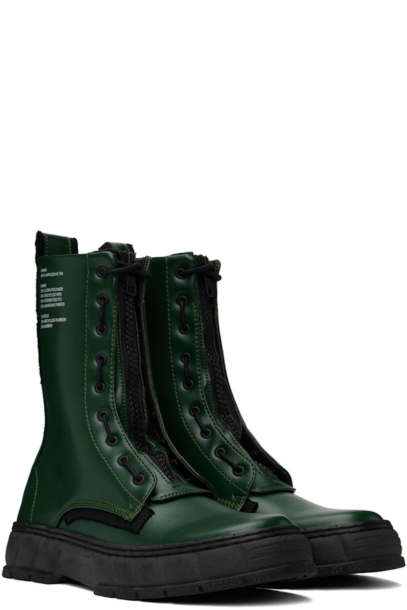 Handcrafted ankle-high PETA-certified buffed Appleskin™ faux-leather boots in green. Text printed at outer side.

· Lace-up and zip closure
· Logo printed at tongue
· Pull-loop at heel collar 
· Logo embossed at heel counter
· Grained faux-leather lining 
· Textured rubber midsole
· Treaded rubber outsole

Available exclusively at SSENSE.

Supplier color: Forest green