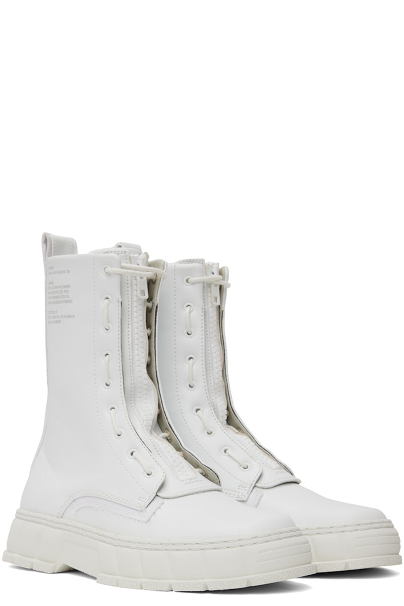 Handcrafted ankle-high PETA-certified buffed Appleskin™ faux-leather boots in white. Text printed at outer side.

· Lace-up and zip closure
· Logo printed at tongue
· Pull-loop at heel collar
· Logo embossed at heel counter
· Twill lining
· Textured rubber midsole
· Treaded rubber outsole

Supplier color: White