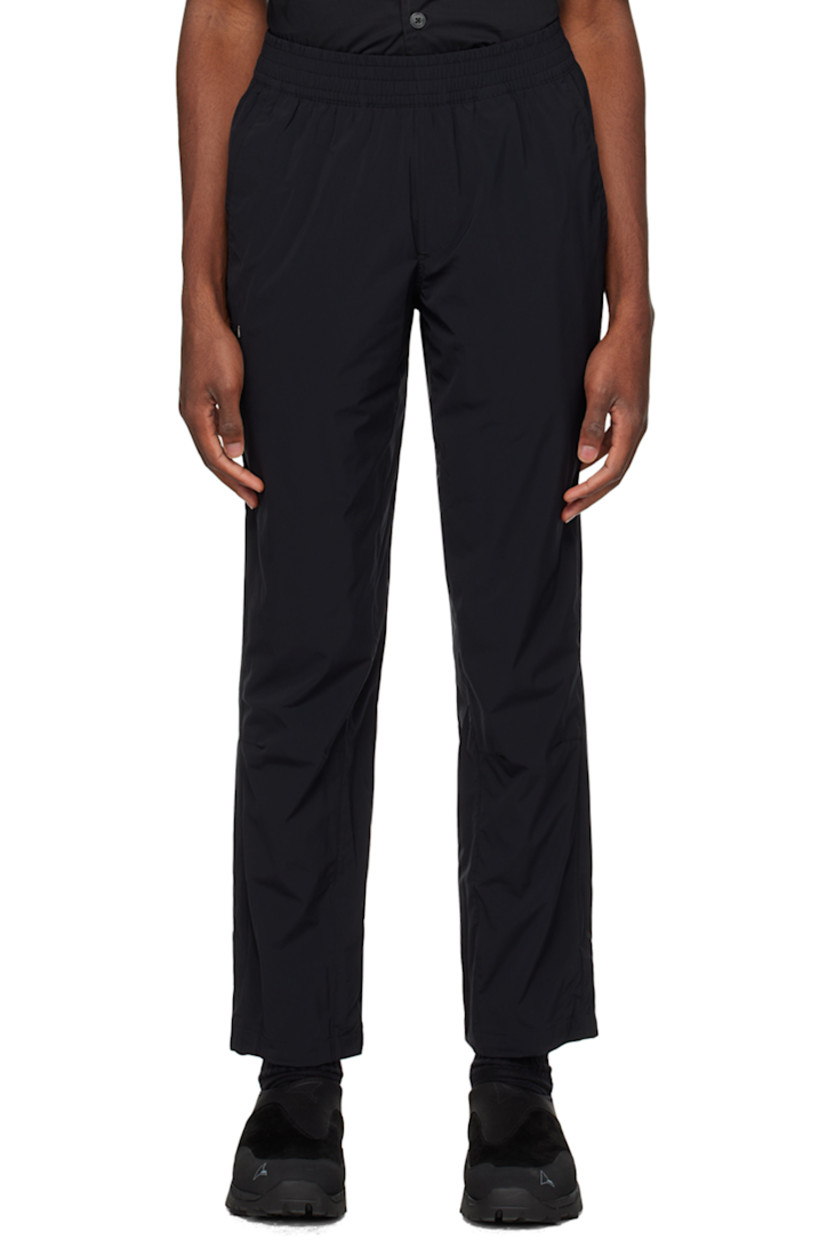 Handcrafted straight-leg stretch regenerated nylon taffeta track pants. Wind-resistant and water-repellent.

· Concealed drawstring at elasticized waistband
· Three-pocket styling
· Mock-fly
· Logo patch at front
· Pleated knees
· Bungee-style drawstring at cuffs

Supplier color: Cosmic