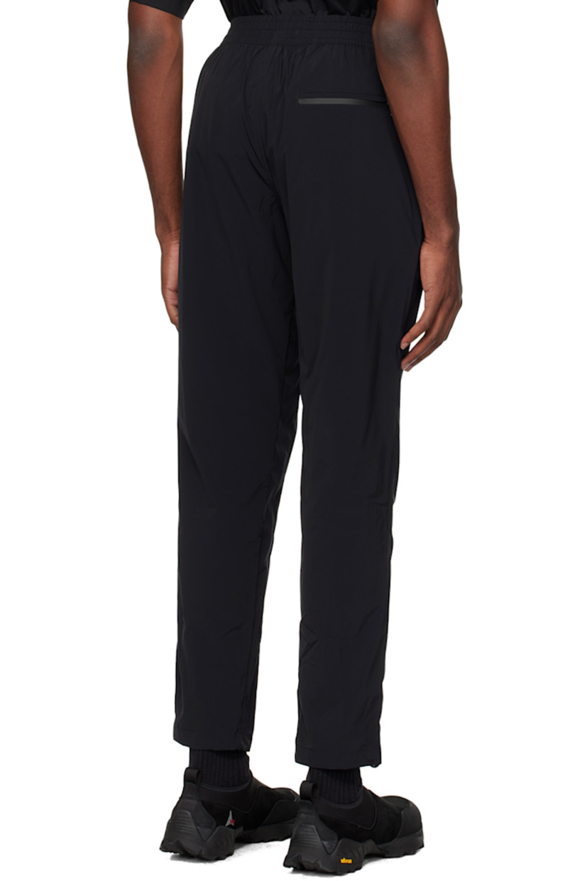 Handcrafted straight-leg stretch regenerated nylon taffeta track pants. Wind-resistant and water-repellent.

· Concealed drawstring at elasticized waistband
· Three-pocket styling
· Mock-fly
· Logo patch at front
· Pleated knees
· Bungee-style drawstring at cuffs

Supplier color: Cosmic