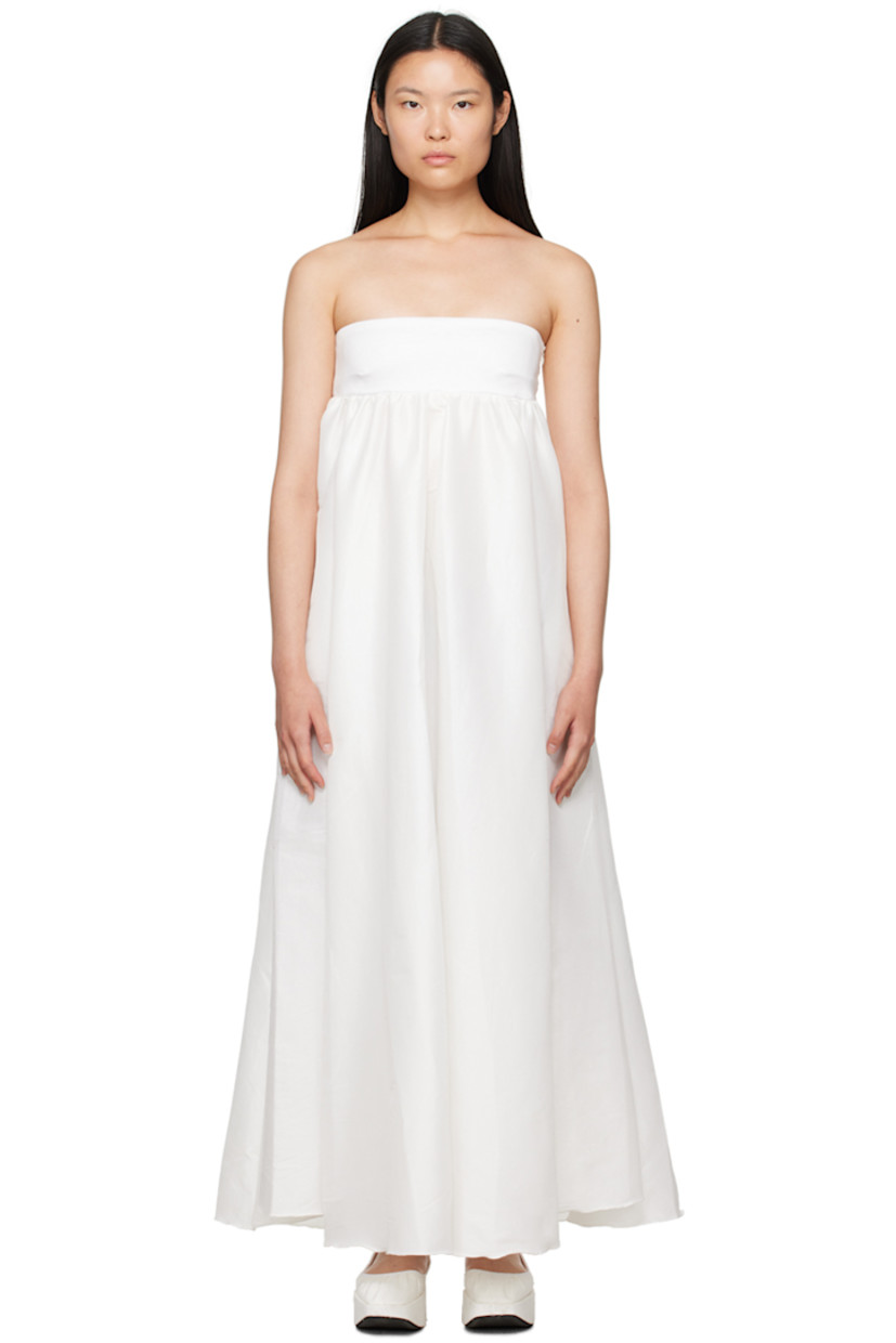 Stretch polyester- and nylon-blend taffeta dress.

· Straight neck
· Gathering at chest
· Flared hem
· Zip closure at side seam
· Tiered trim at back
· Unlined

Available exclusively at SSENSE.

Supplier color: White