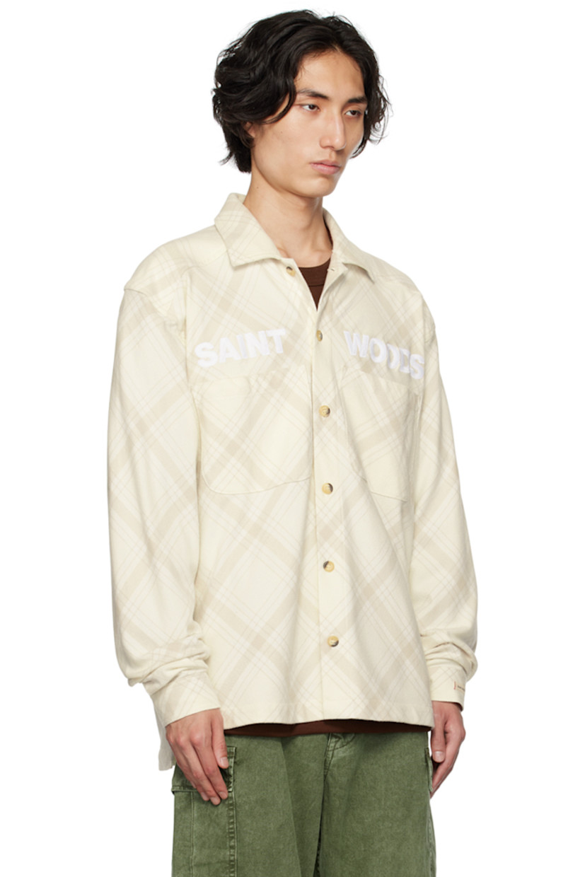Cotton flannel shirt. Check pattern throughout.

· Spread collar
· Button closure
· Logo embroidered at front
· Patch pockets
· Vented side seams
· Logo flag at side seam
· Single-button barrel cuffs
· Tortoiseshell hardware

Supplier color: Bone