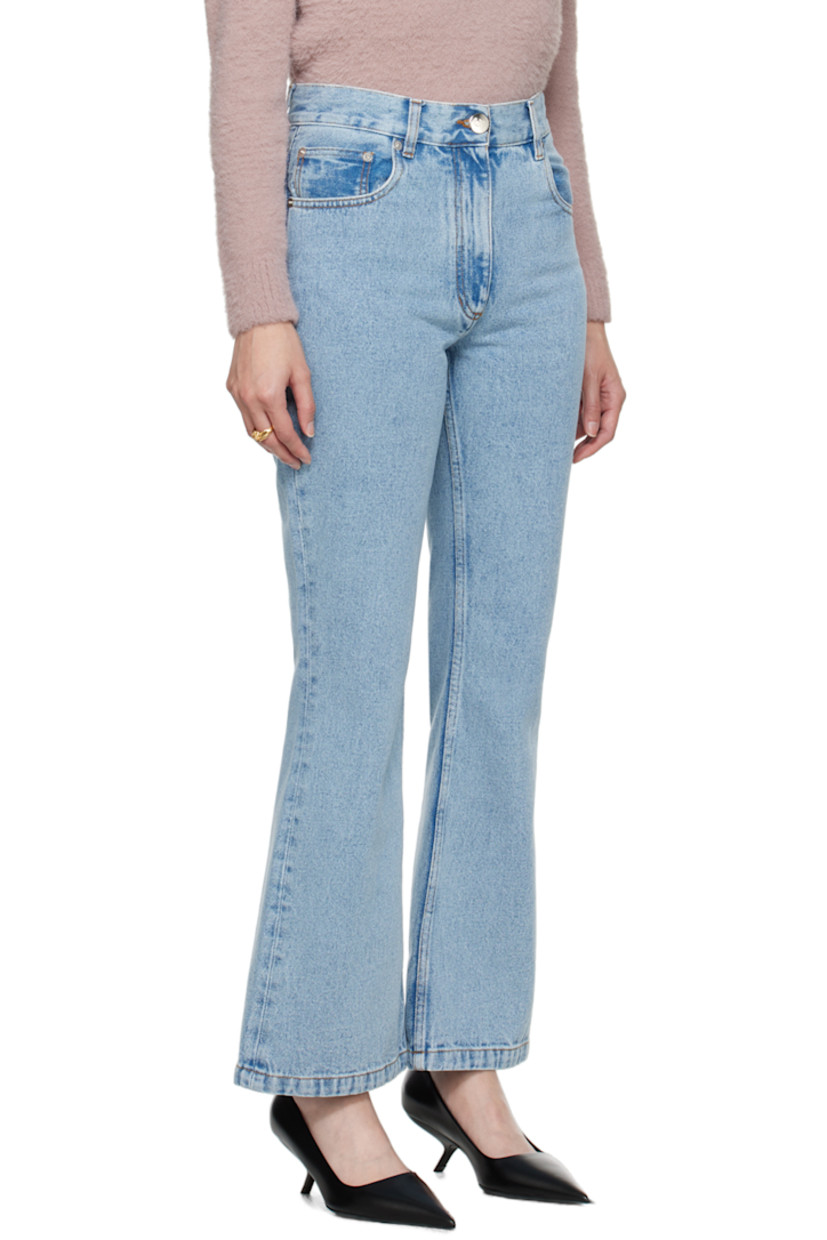 Flared non-stretch organic cotton denim jeans.

· Belt loops
· Five-pocket styling
· Zip-fly
· Leather logo patch at back waistband
· Logo-engraved silver-tone hardware
· Contrast stitching in tan

Supplier color: Light blue organic denim
