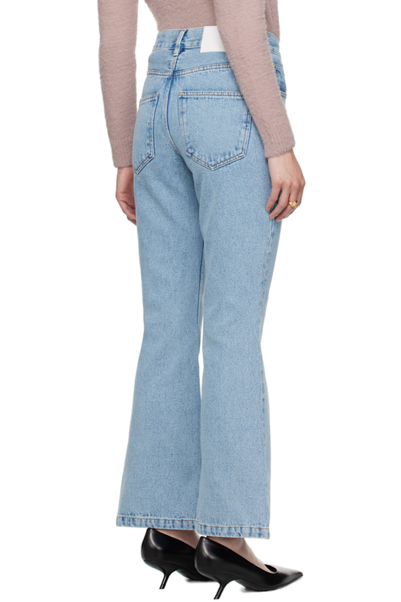 Flared non-stretch organic cotton denim jeans.

· Belt loops
· Five-pocket styling
· Zip-fly
· Leather logo patch at back waistband
· Logo-engraved silver-tone hardware
· Contrast stitching in tan

Supplier color: Light blue organic denim