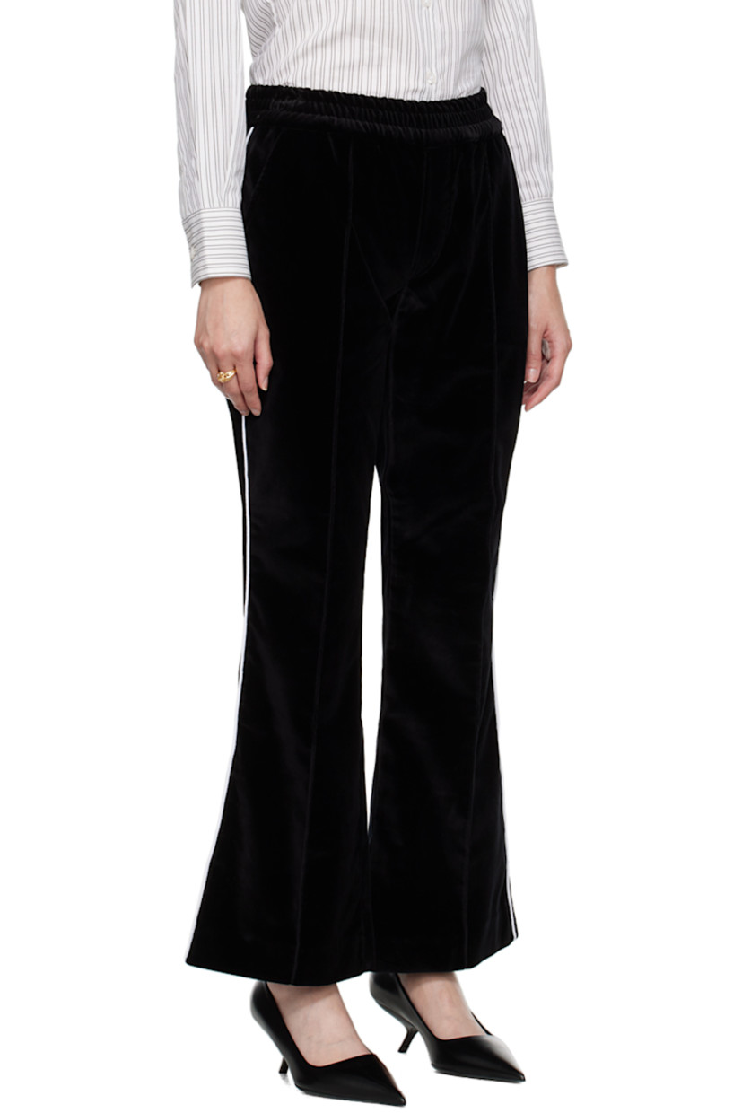 Flared stretch cotton velour lounge pants.

· Elasticized waistband
· Four-pocket styling
· Pinched seams at front and back legs
· Piping at outseams

Supplier color: Black