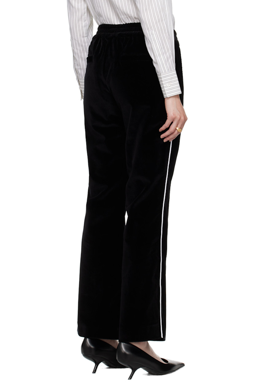 Flared stretch cotton velour lounge pants.

· Elasticized waistband
· Four-pocket styling
· Pinched seams at front and back legs
· Piping at outseams

Supplier color: Black