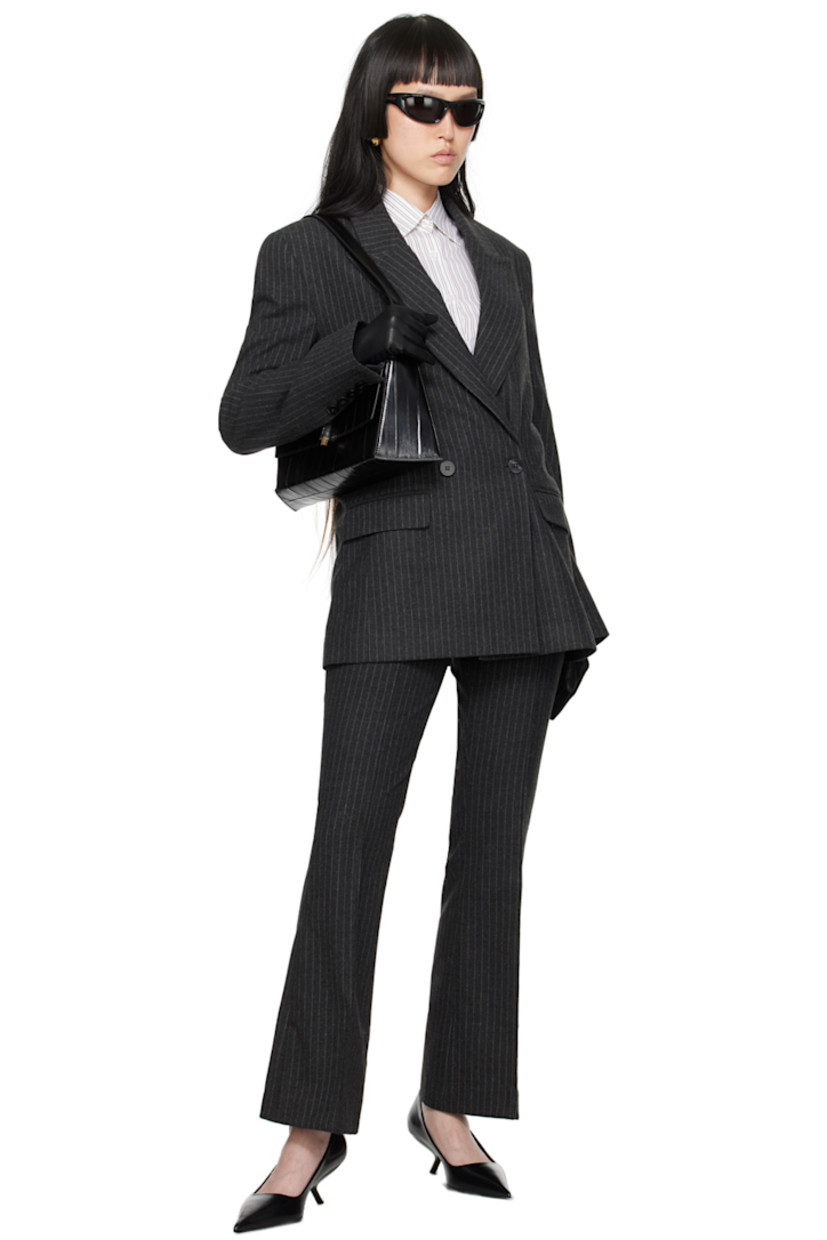 Felted stretch polyester- and viscose-blend twill trousers. Pinstripes throughout.

· Belt loops
· Four-pocket styling
· Zip-fly
· Creased legs
· Flared cuffs
· Logo-engraved hardware 

Supplier color: Grey pin stripe