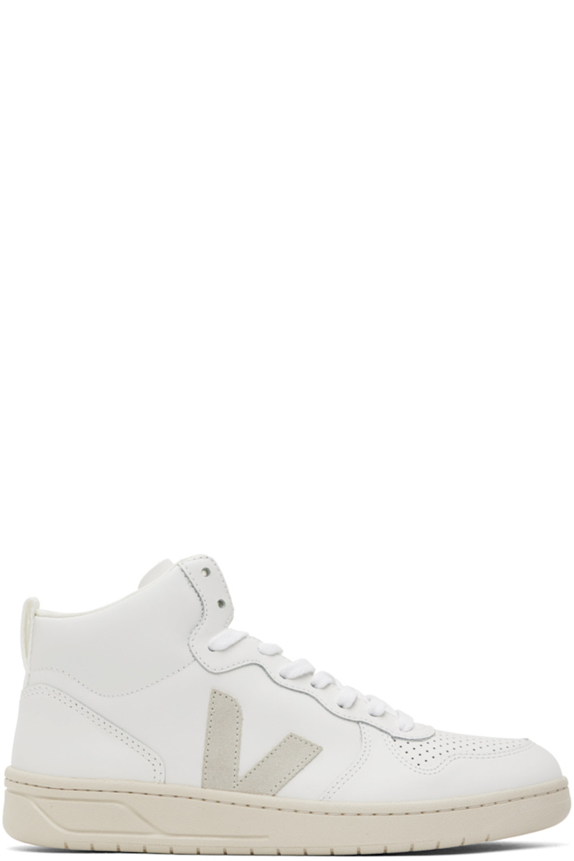 High-top buffed leather sneakers in white.

· Perforated detailing at toe
· Lace-up closure
· Logo embossed at padded tongue
· Pull-loop at padded collar
· Suede logo appliqué at sides
· Recycled mesh lining
· Treaded rubber sole

Supplier color: Extra white/Natural