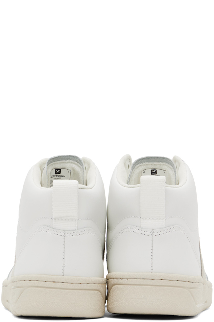 High-top buffed leather sneakers in white.

· Perforated detailing at toe
· Lace-up closure
· Logo embossed at padded tongue
· Pull-loop at padded collar
· Suede logo appliqué at sides
· Recycled mesh lining
· Treaded rubber sole

Supplier color: Extra white/Natural