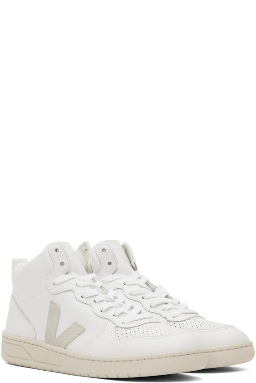 High-top buffed leather sneakers in white.

· Perforated detailing at toe
· Lace-up closure
· Logo embossed at padded tongue
· Pull-loop at padded collar
· Suede logo appliqué at sides
· Recycled mesh lining
· Treaded rubber sole

Supplier color: Extra white/Natural