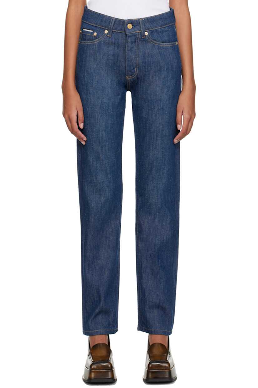 Straight-leg non-stretch denim jeans. Subtle distressing throughout. 

· Belt loops
· Five-pocket styling
· Button-fly
· Rubberized logo patch at back waistband
· Logo graphic embroidered at back pocket
· Contrast stitching in beige

Supplier color: Crude