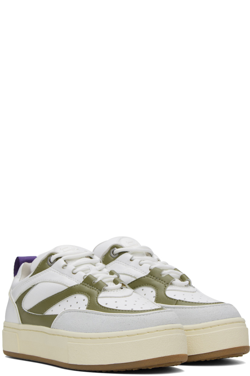 Low-top paneled buffed faux-leather sneakers in white and green. 

· Faux-suede trim at toe
· Perforated detailing at toe and sides
· Lace-up closure
· Padded tongue and collar
· Pull-loop at heel tab 
· Logo embossed at heel 
· Jersey lining
· Textured rubber platform midsole
· Treaded rubber outsole
· Platform: H1.5 in

Supplier color: Vegan olio