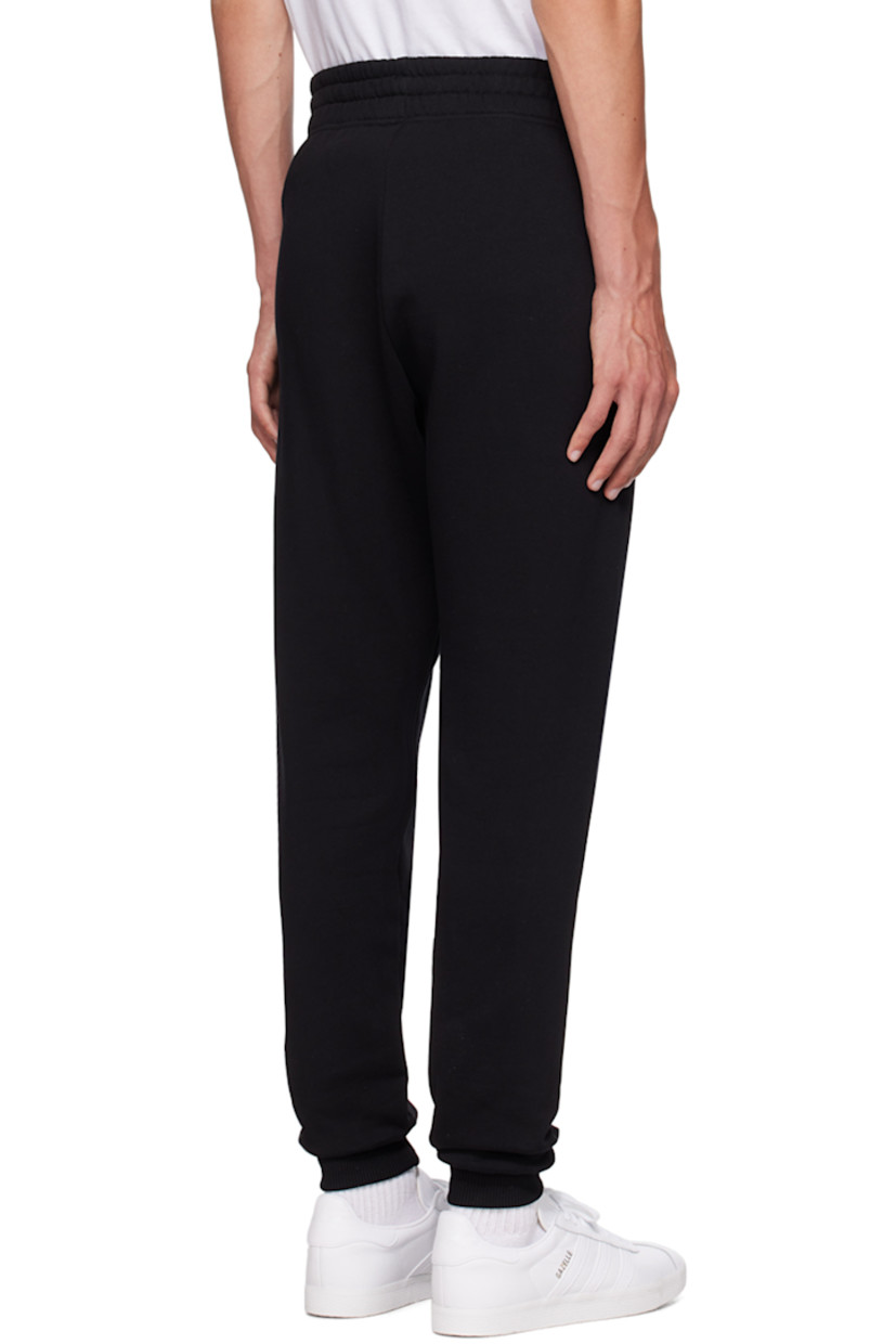 Relaxed-fit 340 g organic cotton fleece sweatpants.

· Concealed drawstring at elasticized waistband
· Two-pocket styling
· Logo patch at front
· Rib knit cuffs

Supplier color: Black