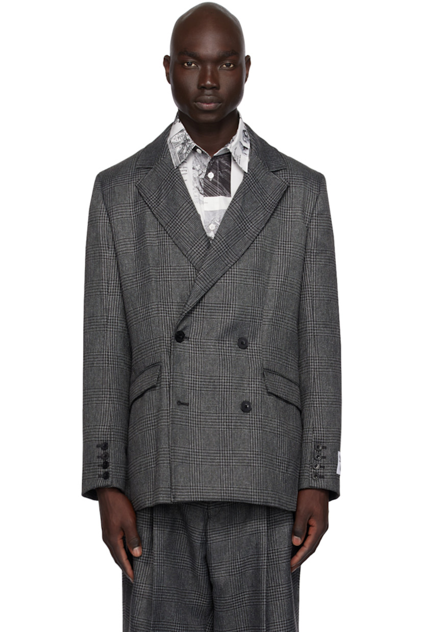 Polyester tweed blazer. Glen check pattern throughout.

· Notched lapel
· Double-breasted button closure
· Flap pockets
· Padded shoulders
· Graphic patch at cuff and back
· Four-button surgeon's cuffs
· Central vent at back hem
· Full organic cotton twill lining

Part of the Études x Batia Suter collection.

Supplier color: Check