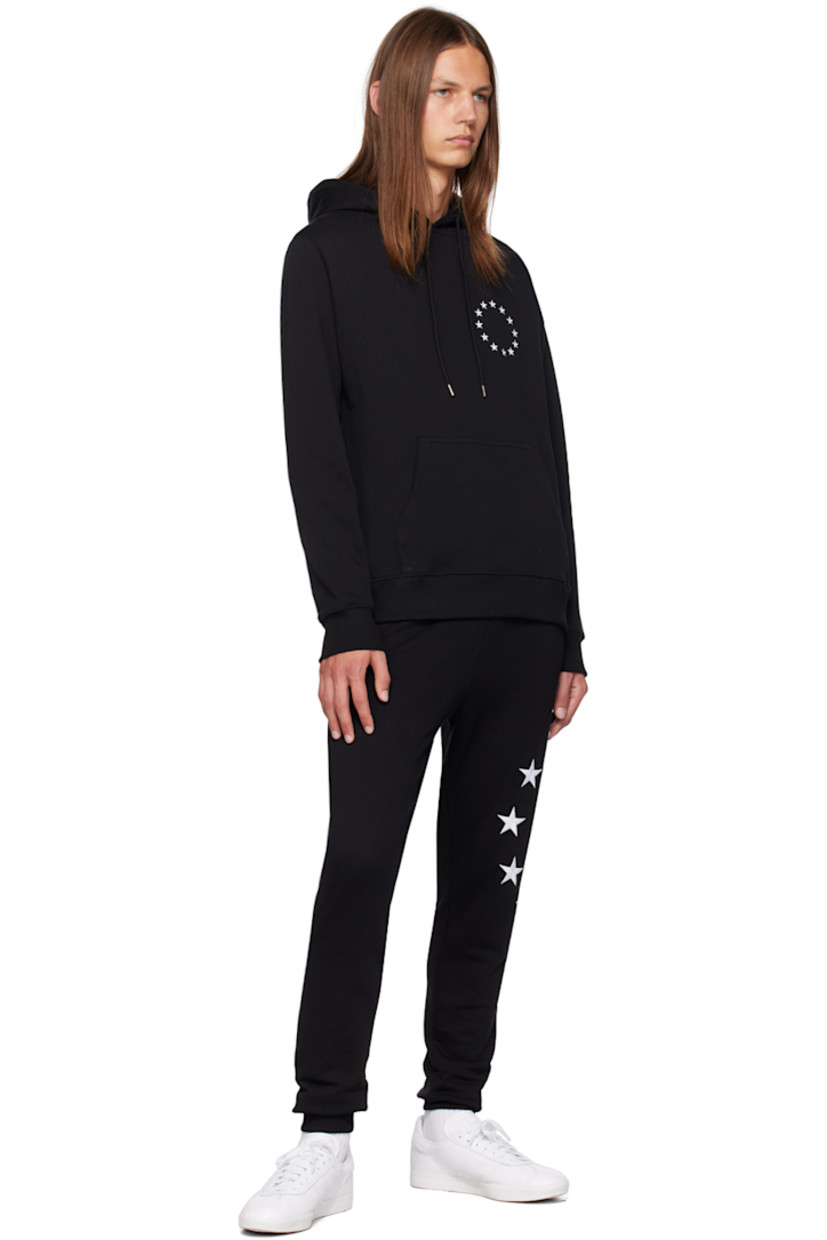 Organic cotton fleece hoodie.

· Drawstring at hood
· Logo graphic embroidered at chest and back
· Kangaroo pocket
· Rib knit hem and cuffs

Supplier color: Black