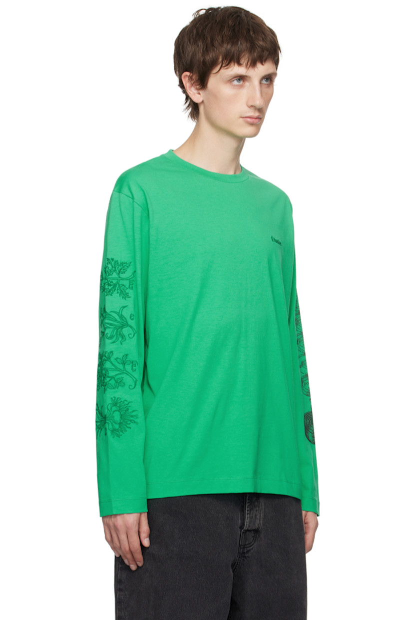Organic cotton jersey T-Shirt

· Rib knit crewneck
· Logo embroidered at chest
· Graphic embroidered and printed at sleeves and back 

Part of the Études x Batia Suter collaboration.

Supplier color: Mint