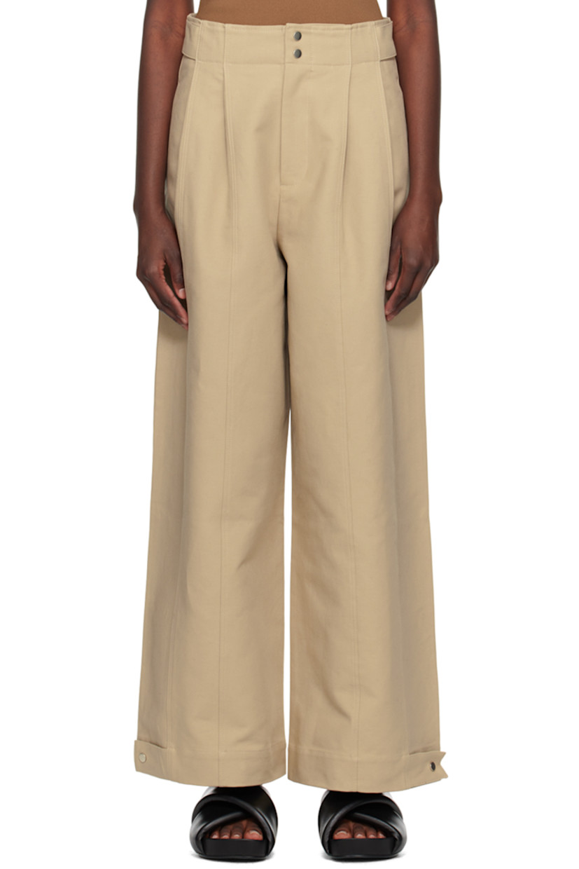 Plain-woven cotton trousers. 

· Adjustable press-stud tabs at waistband and cuffs
· Three-pocket styling
�· Zip-fly
· Pleats at front

Supplier color: Khaki